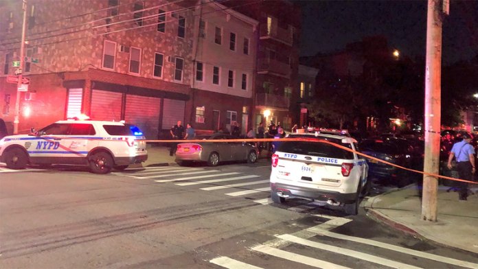 wabc-queensshooting-img Police surround an apartment in Astoria where 4 people, including a child, were shot dead.
